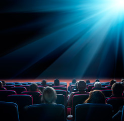 Fototapeta na wymiar viewers look at shining star in the cinema