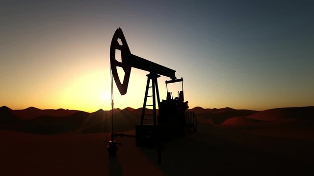 Oil Pump in desert on sunset