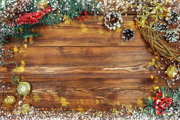 Fototapeta na wymiar Christmas wooden background with snow branch. Top view with copy space for your text