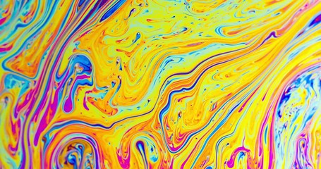 Macro shot of a soap bubble creates a colorful and psychedelic background. - Powered by Adobe