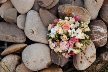 Wedding bouquet in the background. Wedding bouquet on the stones. Wedding decoration