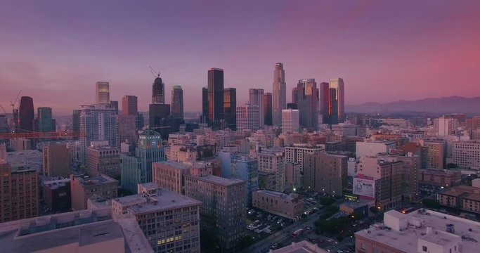 Aerial view city downtown Los Angeles skyline at sunset twilight dusk. 4K UHD