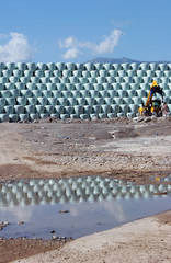 Packing bales with garbage, Wrapped stacked bales round with white plastic film,  Recycling and recovery of packaging waste, Plastic baling, panoramic