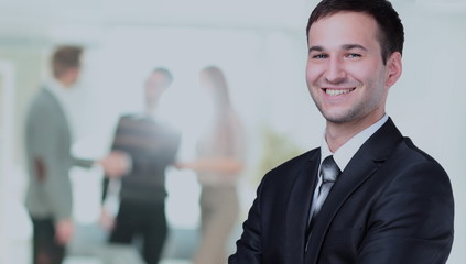 Happy mature business man looking at camera with satisfaction at office