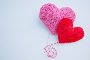 Colorful yarn ball isolated on white background. Space for text. Red heart like a symbol of love. Hobby concept.heartbeat,feelings, romance concept	