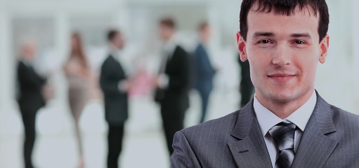 Happy mature business man looking at camera with satisfaction at office