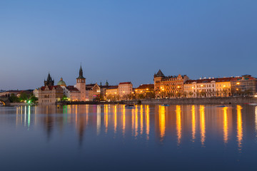 Fototapeta premium Scenic summer evening view of the Old Town ancient architecture and Vltava river pier in Prague, Czech Republic