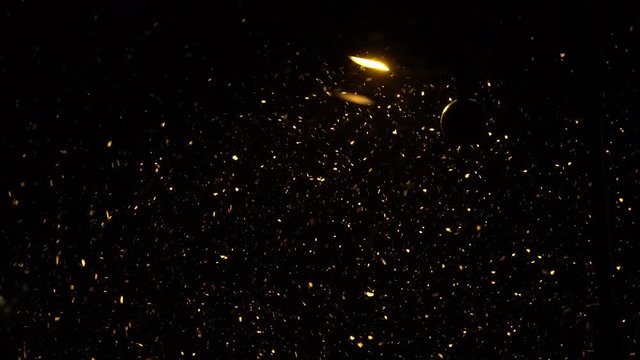 Snow falling at night in street lighting - (4K)