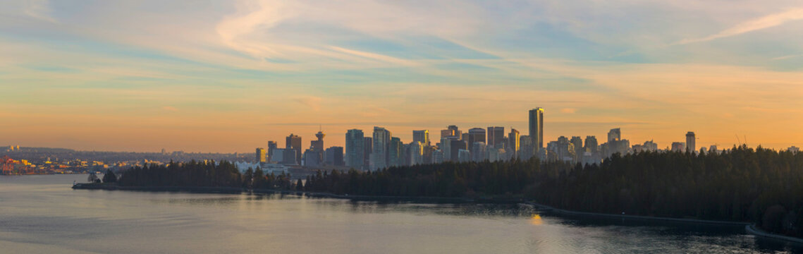 Vancouver BC Canada Skyline Along Stanley Park At Sunset