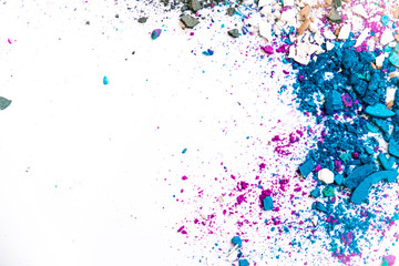 makeup trends. Samples of dry blush, powder, bronzers and highlighter scattered on a white...