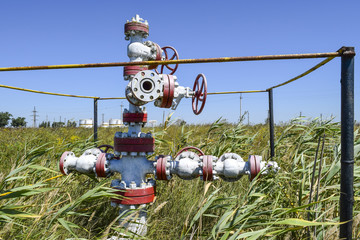 Well for oil and gas production. Oil well wellhead equipment. Oil production