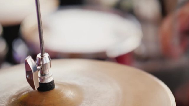 Drum sticks hit the plates. Video with shallow depth of field