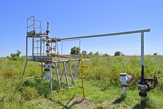 Well for oil and gas production. Oil well wellhead equipment. Oil production