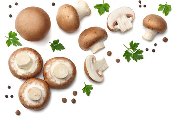 Fresh champignon mushrooms with parsley isolated on white background. top view