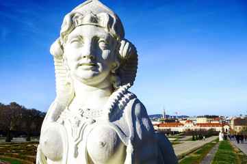Closeup head of statue white stone of woman sphinx in Belvedere Baroque Garden, Vienna, Austria