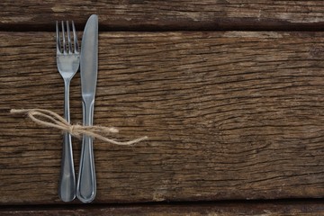 Fork and butter knife tied up with a rope