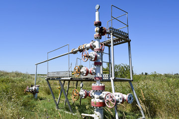 Well for oil and gas production. Oil well wellhead equipment. Oil production