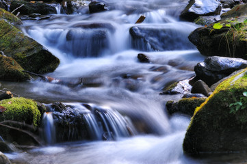 Naklejka na ściany i meble autumn waterfall. Picturesque creek in the Carpathian Mountains