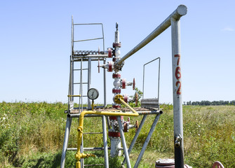 Well for oil and gas production. Oil well wellhead equipment. Oil production