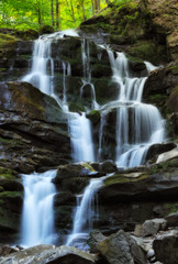 Fototapeta na wymiar autumn waterfall. Picturesque creek in the Carpathian Mountains