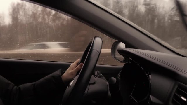 Woman With Steering Whell Driving In Winter Day
