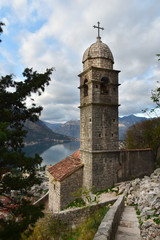 Fototapeta premium ‘Our Lady of Remedy’ Church high above the town and the bay of Kotor, Montenegro