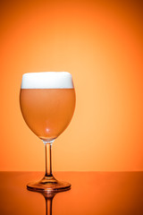 Bottle of beer and glass full foam condensate cold refreshing