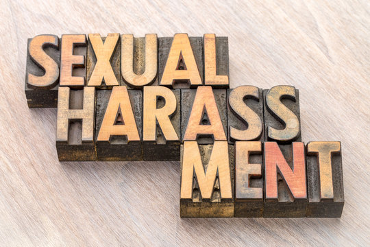 sexual harassment word abstract in wood type