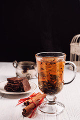 hot green tea with cinnamon on white background