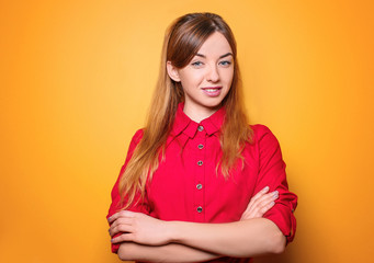 Young smiling woman on color background