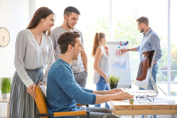 Group of young professionals having meeting in office