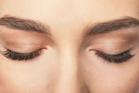 Closed female eyes with long eyelashes, closeup