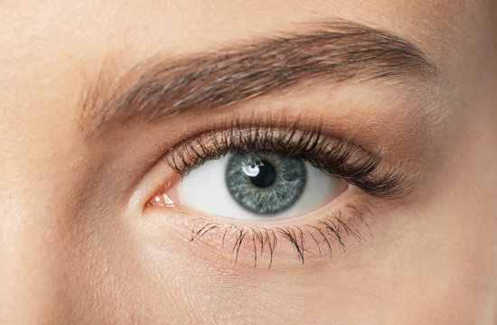 Female eye with long eyelashes, closeup
