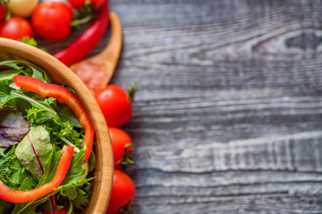 Fresh rustic vegetable salad on rustic background