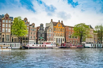 Fototapeten Amsterdam, the Netherlands, September 5, 2017 :typical dutch houses and houseboats. Amsterdam, Holland, Netherlands © EwaStudio