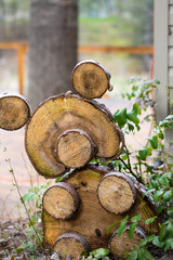 Bear made from logs in a rustic cabin setting