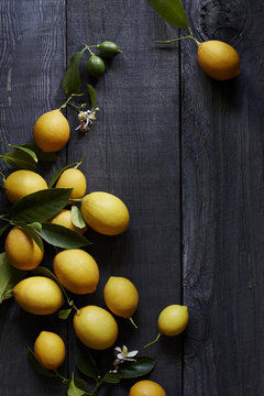 Ripe Meyer lemons on wooden table