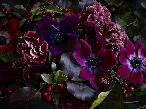 Winter flowers with hollies, anemones and carnations