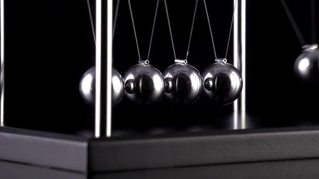 Newton's Cradle in slow motion.