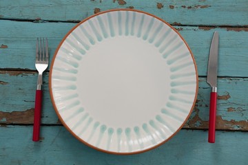 Table setting on weathered wooden plank