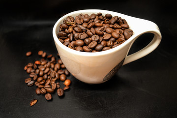Coffee Beans In Cup On Black Background Close Up Isolated