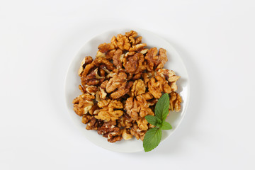 plate of peeled walnuts