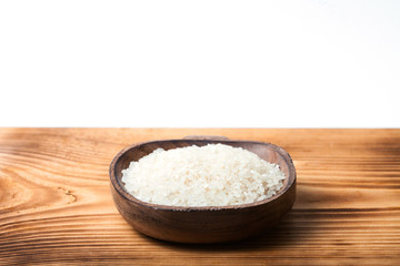 Raw rice on wood desk 