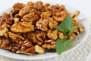 plate of peeled walnuts