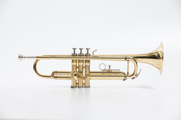 Naklejka na ściany i meble Gold lacquer trumpet with mouthpiece isolated on white
