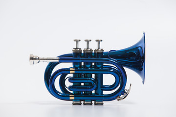 Blue small trumpet with mouthpiece isolated on white