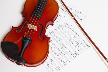Obraz na płótnie Canvas Violin, bow and music sheets 