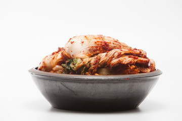 Kimchi on a crock head dish isolated