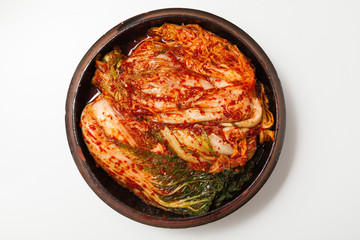Kimchi on a crock head dish isolated - obrazy, fototapety, plakaty