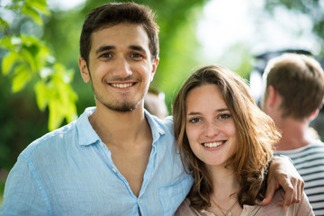 During a party, Portrait of a young couple looking at camera
